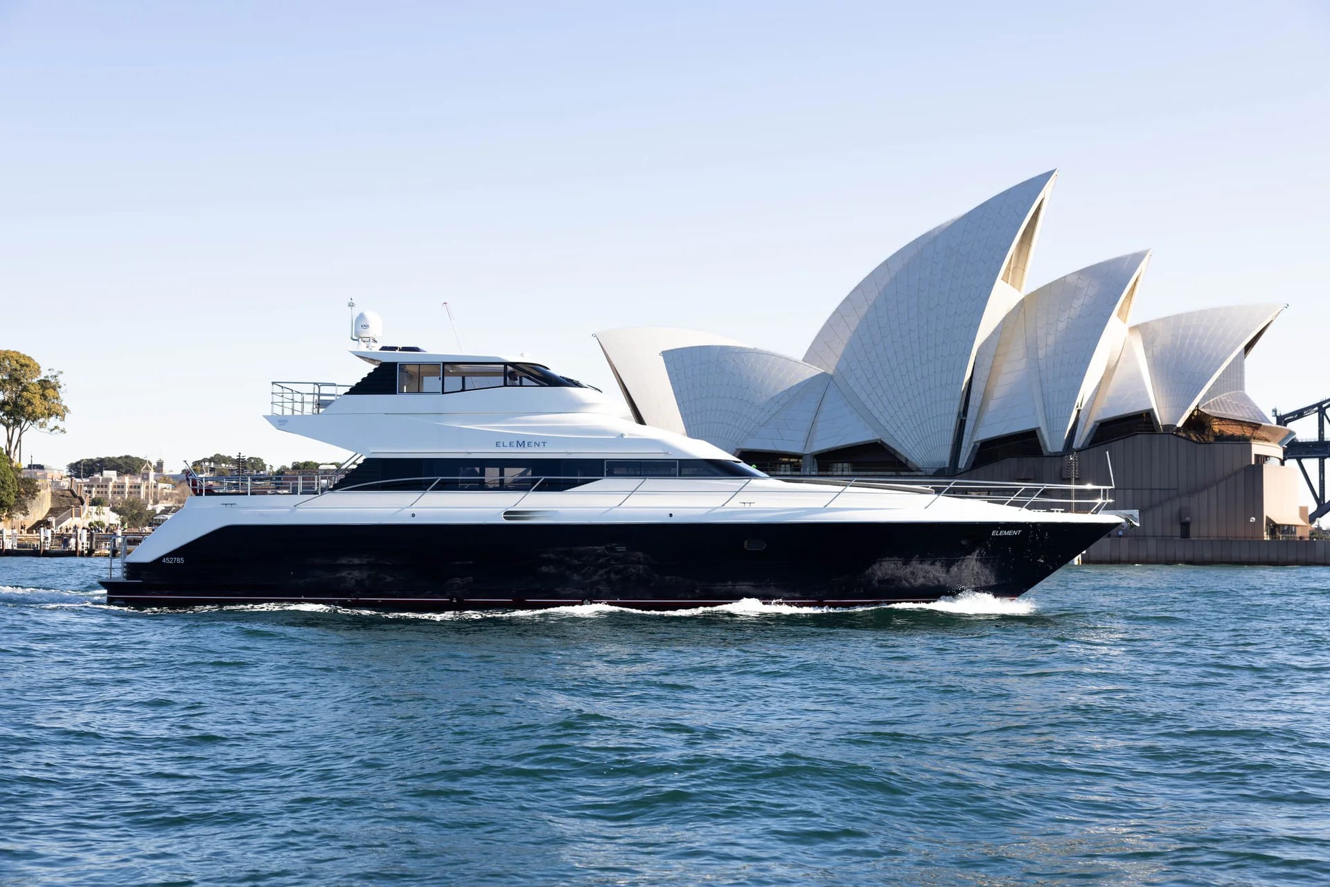Element in side profile on Sydney Harbour with the Sydney Opera House behind.