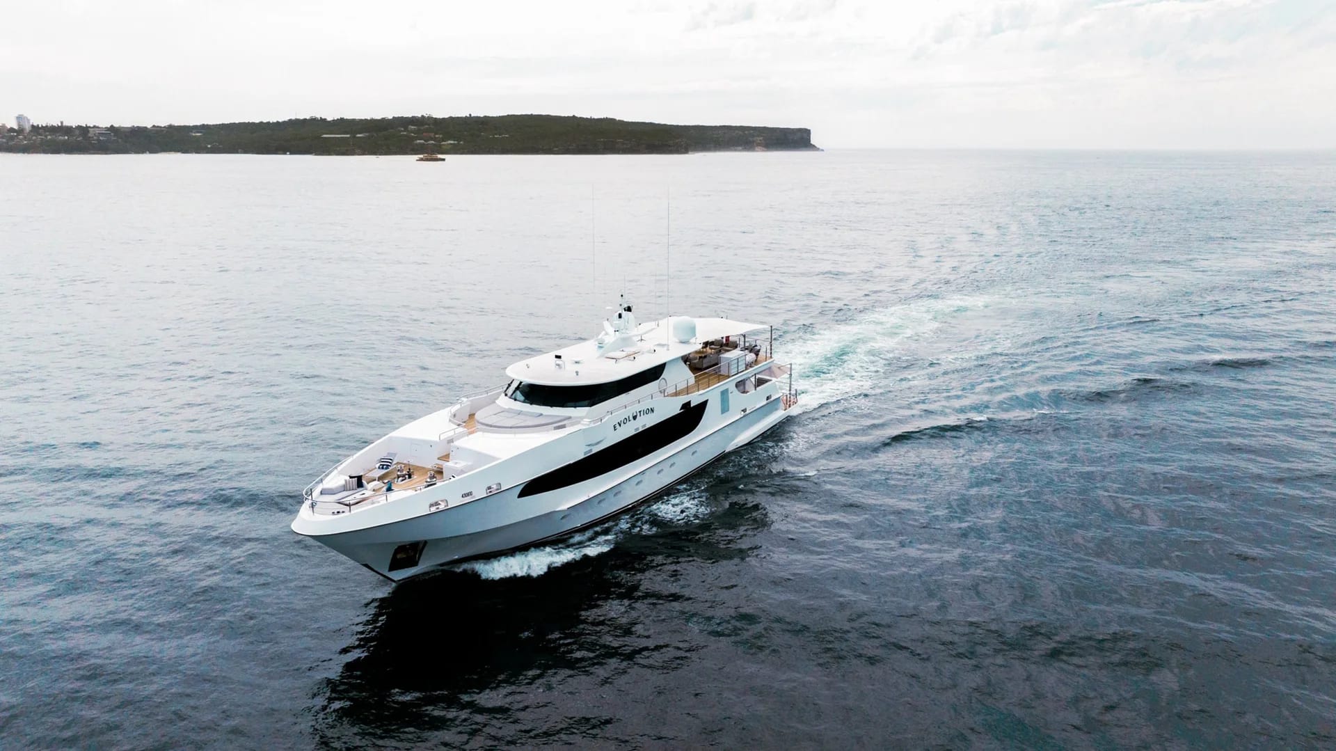 Aerial view of Evolution underway on open water.