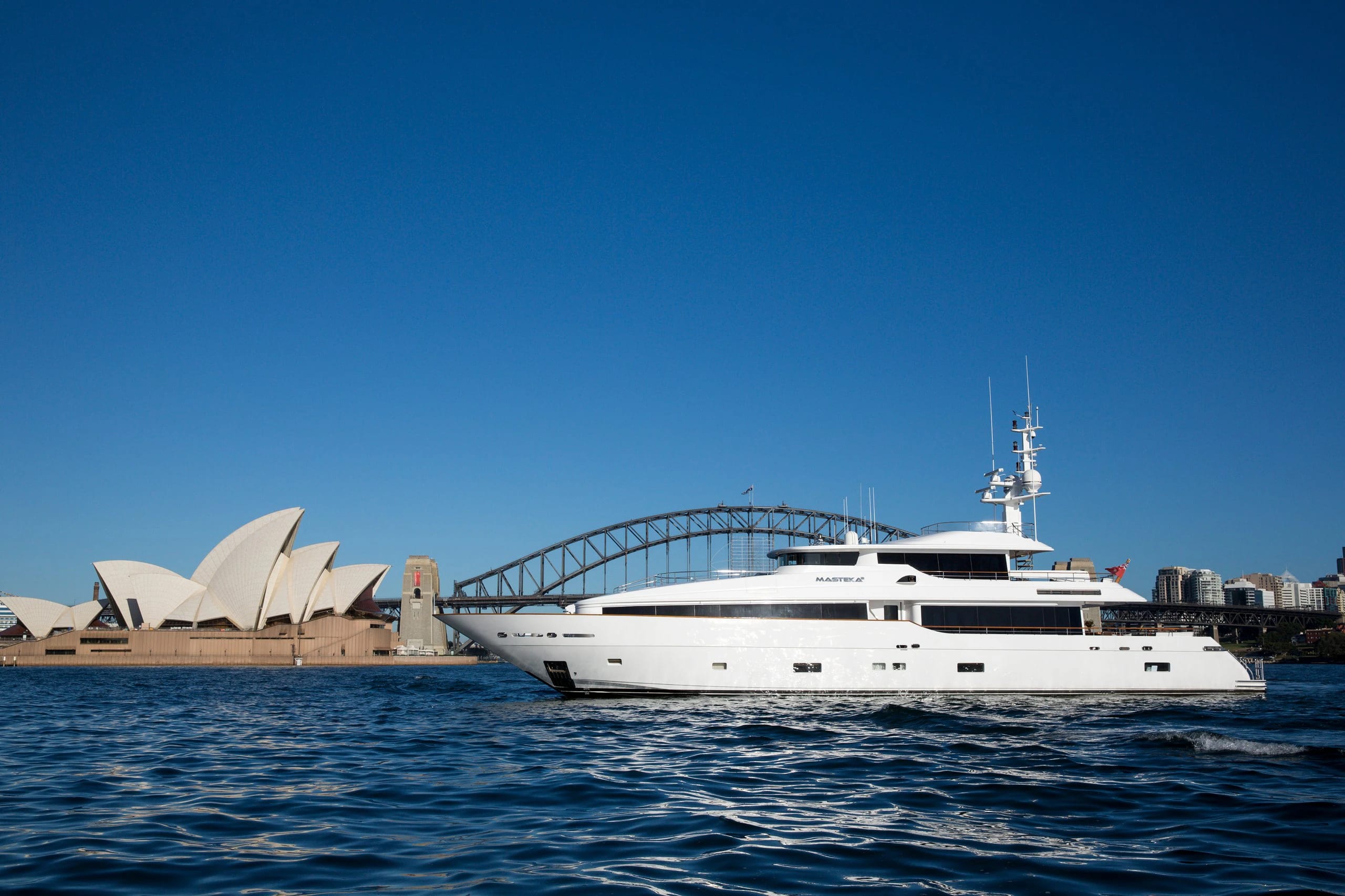 Masteka 2 cruising on Sydney Harbour past the Opera House and Harbour Bridge