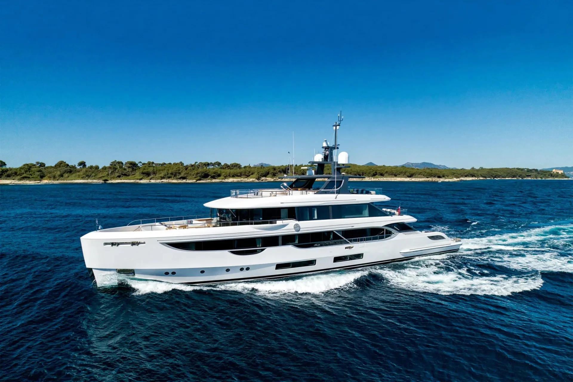 Northern Escape underway in side profile on deep blue water