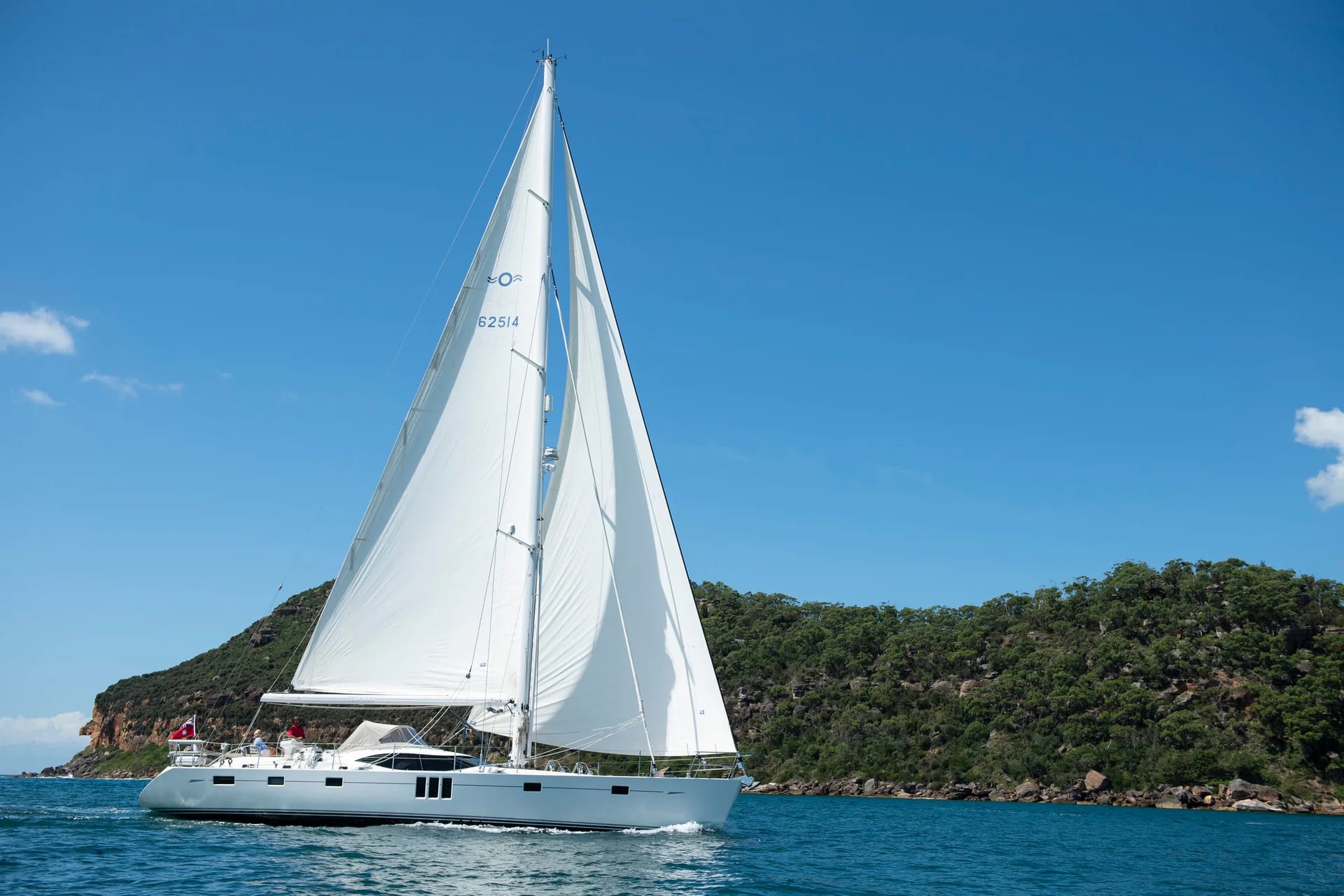 Pegasus sailing in full side profile with mainsail raised