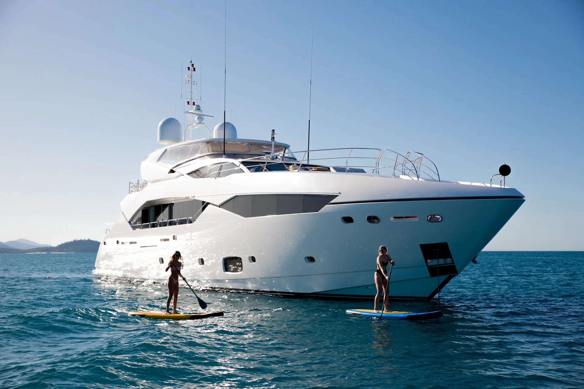 Rascal viewed from the bow with paddleboarders alongside.